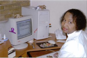 A woman with short hair wearing a black jacket.